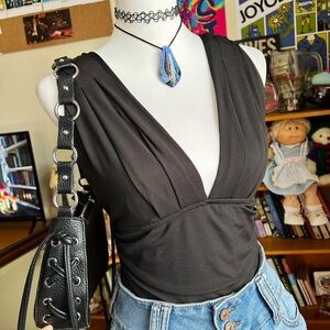 Black Sleeveless Top Black bodysuit with plunge V-neck top and open back